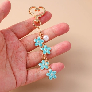 Sweet blue enamel cherry blossom keychain with pearl and gold heart clasp for handbags
