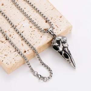 Nordic Viking raven skull pendant with stainless steel square chain on stone