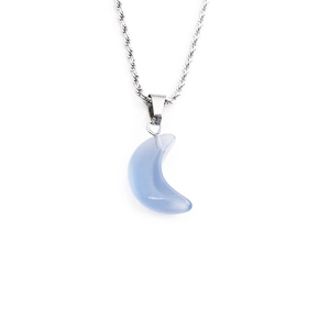Detailed close-up of a crescent moon pendant with blue gemstone and silver twist chain