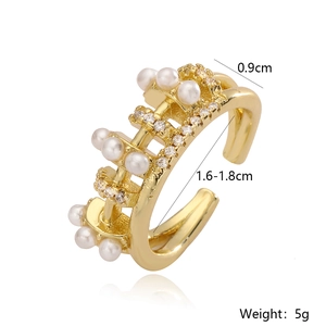 Detailed view of gold plated geometric open ring with pearls and cubic zirconia