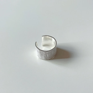 Detailed macro view of the S925 sterling silver stamp on the inner smooth band of the ring