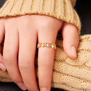 Elegant gold openwork heart ring for women with sparkling cubic zirconia stones