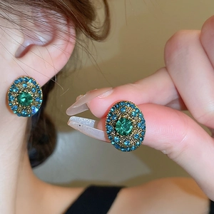 French vintage luxury oval geometric earrings with green gemstones and teal rhinestones