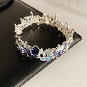 Detailed close-up of butterfly stretch bracelet with blue enamel and sparkling crystals