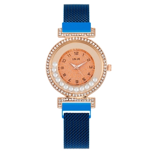 Women's rose gold watch with sparkling crystals and navy blue magnetic mesh strap