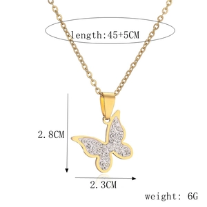 Detail view of gold butterfly pendant with rhinestones and size specifications