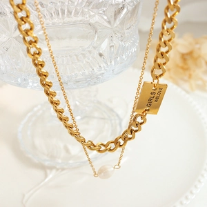 Double-layered gold chain necklace with freshwater pearl and engraved metal tag detail
