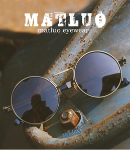 Detail of steampunk round sunglasses with bronze metal frame and spring temple components