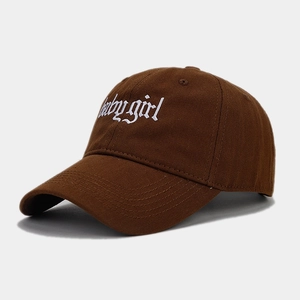 Detail of babygirl gothic embroidery on dark brown cotton twill baseball cap