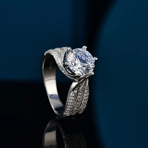 Macro shot of 5-carat round cut moissanite ring with AU750 hallmark on polished silver band