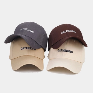 Detail of cotton baseball caps in four colors featuring Gathering 3D embroidery