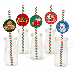 Close-up of Christmas themed paper straws with gingerbread man and snowman card inserts