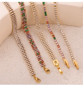 Detailed close-up of gold-plated tennis bracelets with colorful inlaid zircon stones