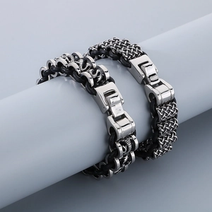 Detail of retro punk dragon bead steel bracelets with black braided leather and spring clasp