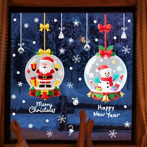 Detail of Christmas window clings with Santa Claus and Snowman in a winter scene