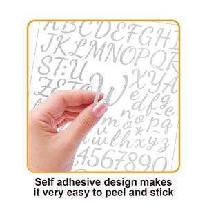 Detail showing peeling a 1-inch glitter holographic alphabet sticker from adhesive backing