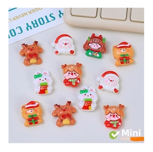 Close-up of festive resin charms featuring Santa, reindeer and rabbits for DIY crafts