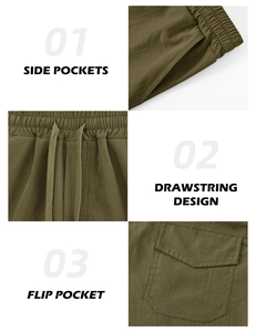 Detail of olive green athletic shorts featuring elastic drawstring waist and side pockets