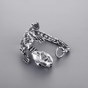 Detailed view of punk style stainless steel crocodile skeleton bracelet with skull links