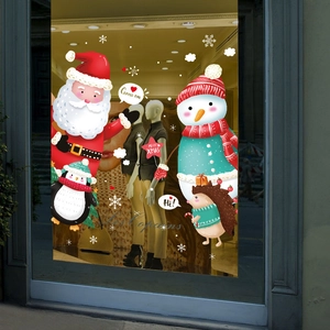 Christmas wall stickers with Santa Claus and snowman displayed on a window pane
