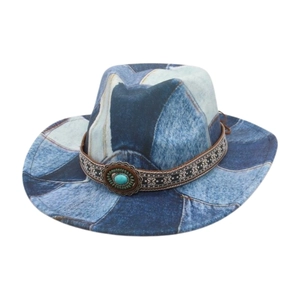 Close-up of denim patchwork cowboy hat with ethnic patterned band and turquoise stone