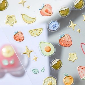 3D embossed fruit nail stickers featuring strawberries and oranges with tactile textures