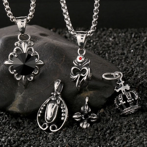 Vintage gothic men's necklace set with crown and cross pendants on dark textured stones