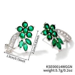 Detailed view of silver flower earrings with emerald zircon and 1.9cm x 2.1cm dimensions