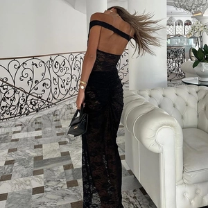 Back view of a sexy black lace backless evening dress with a long slit skirt