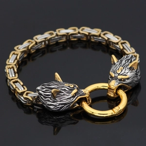 Detail of Viking wolf head bracelet with bicolor Byzantine chain on black background