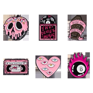 Detailed set of six gothic pink enamel pins featuring skull apple and heart shapes