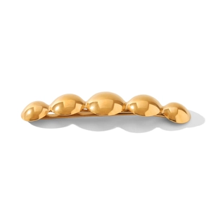 Minimalist gold stainless steel hair clip with five polished domed spheres on white background