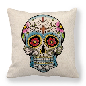 Close-up of beige linen pillowcase featuring a colorful Mexican Day of the Dead skull