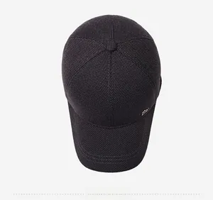 Top view of men's winter baseball cap with dark textured knit fabric and metal logo