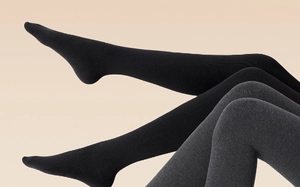 Detailed close-up of ribbed texture on thick thermal leggings in black and dark grey