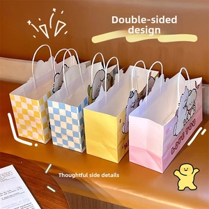 Close-up of four cute cartoon gift bags with colorful patterns and sturdy white handles