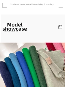 Close-up of wool scarves in multiple colors showing soft texture and fringe details