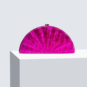 Pink marble pattern semi-circle acrylic clutch bag with gold clasp on display pedestal