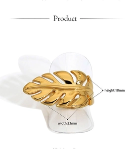 Detailed view of leaf-shaped gold ring with 33mm width and 18mm height measurement