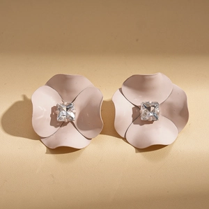 Detailed view of pink matte flower earrings featuring a square crystal center stone