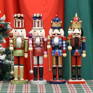Set of four wooden Christmas Nutcracker soldiers in festive red, green, and blue outfits