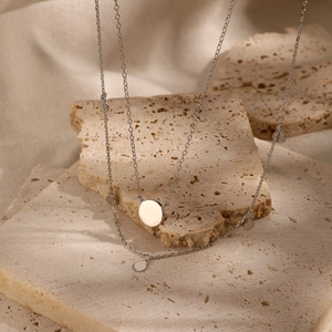 Double-layer 925 sterling silver necklace with polished round pendants on stone