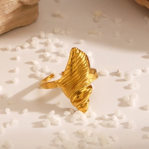 Golden conch shell open ring with spiral texture for a beach-inspired summer look