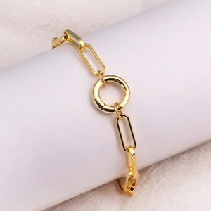Close-up of a gold-plated rectangle link chain bracelet with a circular ring pendant
