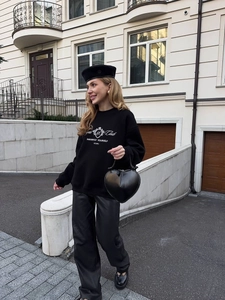 Street style black sweatshirt detail with Royal Club letter print and crown shield logo