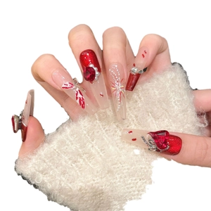 Long trapezoid red press-on nails with silver butterfly design and pearl rhinestones