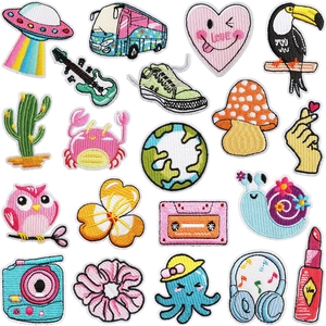Flat lay of 20 assorted colorful cartoon embroidery patches including animals and plants