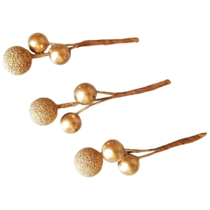Close-up of golden frosted berry picks for Christmas floral arrangements and decor