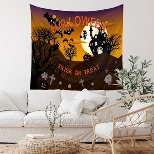 Detail of Halloween tapestry with spooky castle and pumpkin on a living room wall