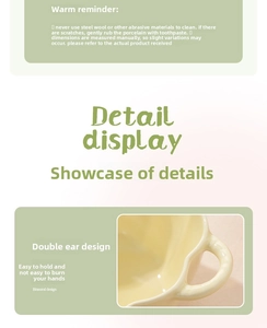 Detail of light yellow ceramic bowl featuring double handles for heat protection